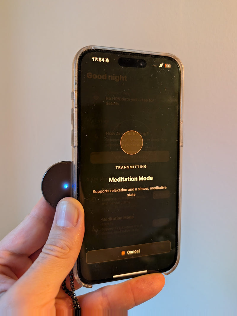 OneDevice held against the back of a phone, USB-C port facing up