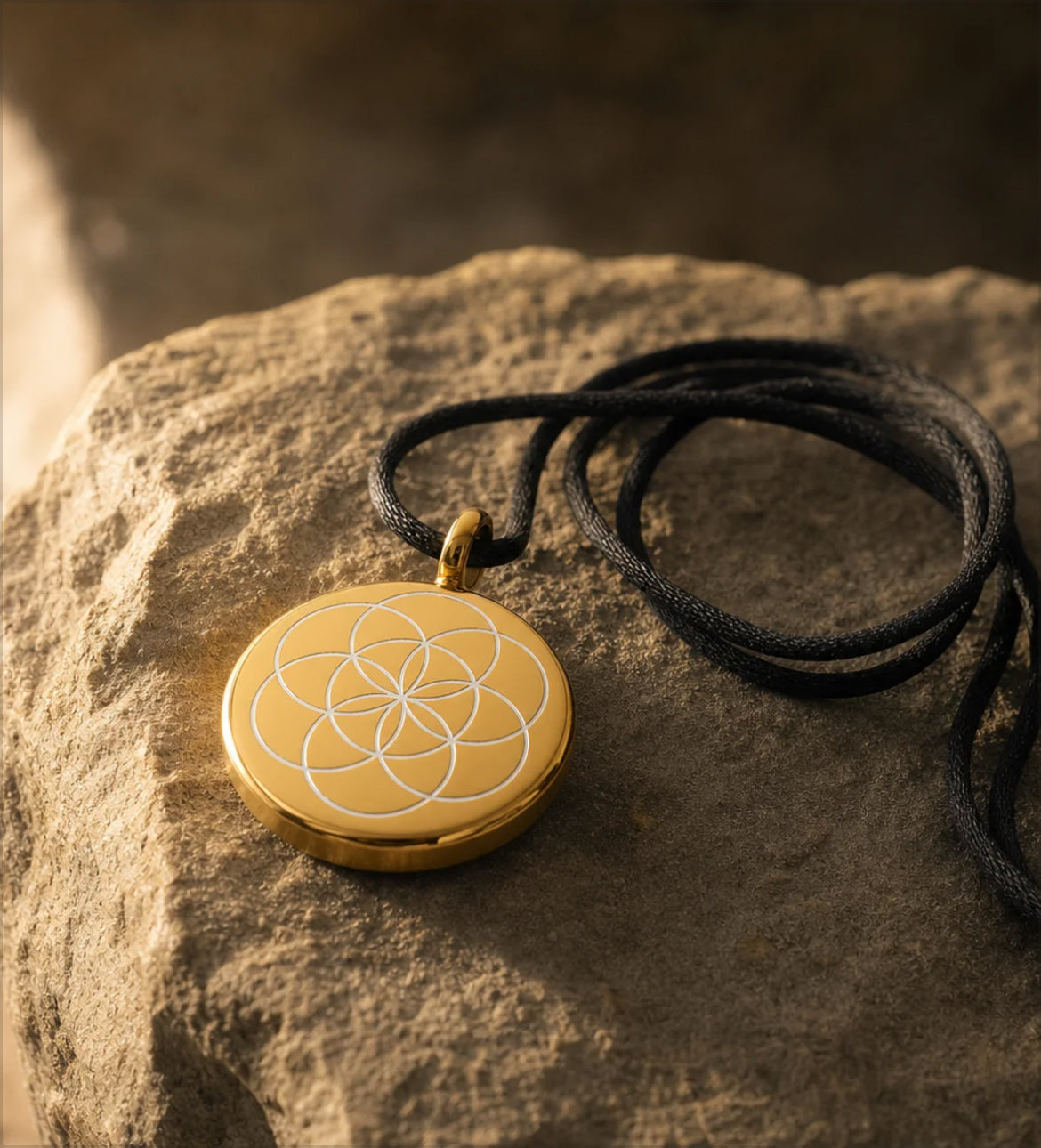 The gold device resting on natural material in warm light